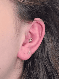 Conch piercing performed by Jane at Eternal Gold in Glasgow with a 14kt yellow gold pice by Buddha Organics. There is also a second lobe there also performed by Jane using Buddha Organics