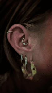Daith piercing with 14kt yellow gold seam ring by junipurr jewellery