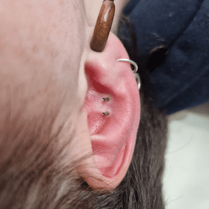 Double conch pierced by Jane at Eternal Gold studio in Glasgow with implant grade titanium