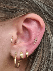 Helix piercing performed by Jane at Eternal Gold in Glasgow with a 14kt yellow gold dagger