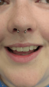 Septum piercing fitted with a titanium horseshoe