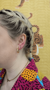 Stacked lobe pierced at eternal gold with titanium opals