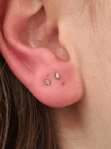 Stacked lobes performed by Jane at Eternal Gold in Glasgow with a 14kt yellow gold tri bead and CZ baguette cut pieces by Buddha Organics