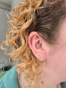 Upper lobe piercing performed by Jane at Eternal Gold in Glasgow with an implant grade titanium pice of jewellery that has been anodised yellow